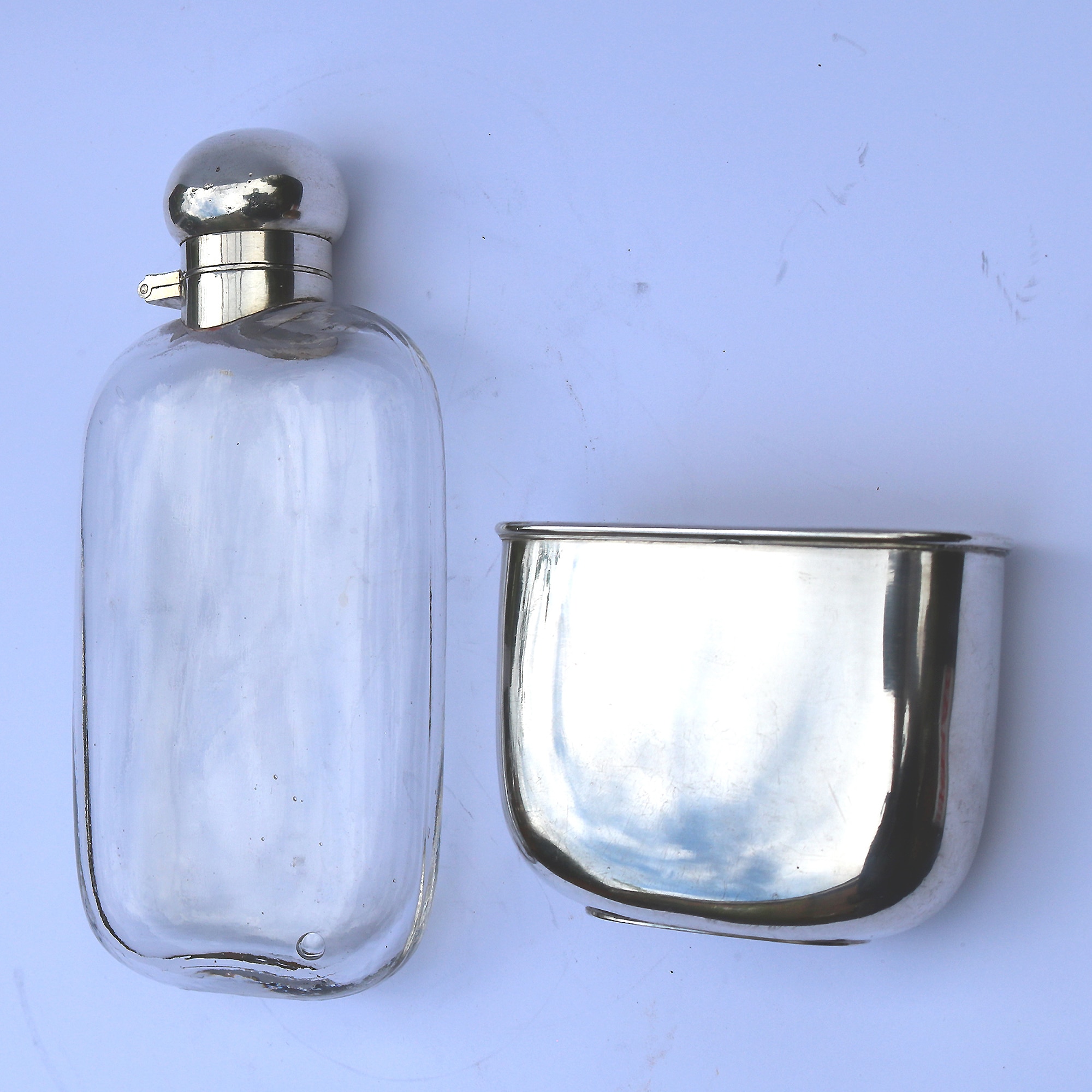 A good and attractive silver plated and glass Hip Flask by Harrods C.20thC