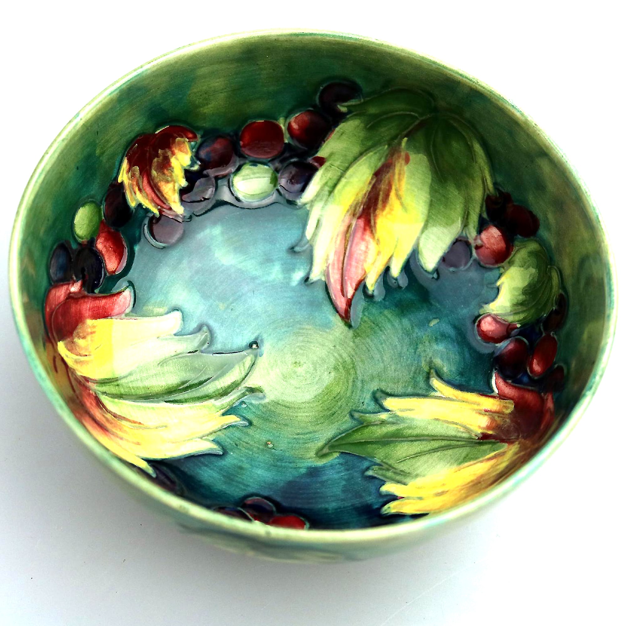 A good William Moorcroft antique British Art Pottery leaf & berry Bowl C.1928