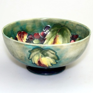 A good William Moorcroft antique British Art Pottery leaf & berry Bowl C.1928