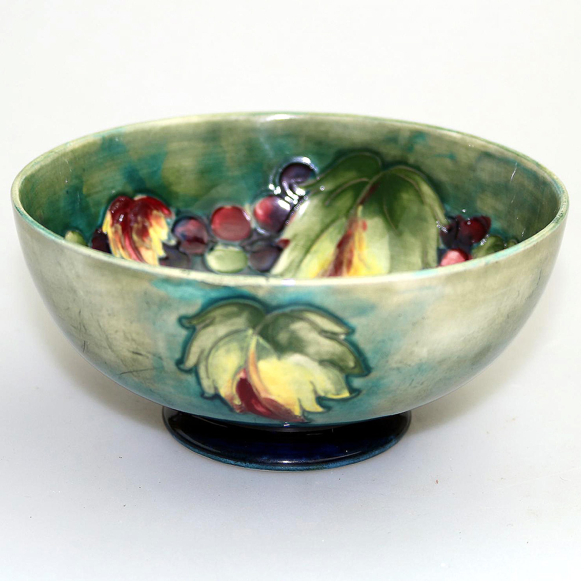 A good William Moorcroft antique British Art Pottery leaf & berry Bowl C.1928