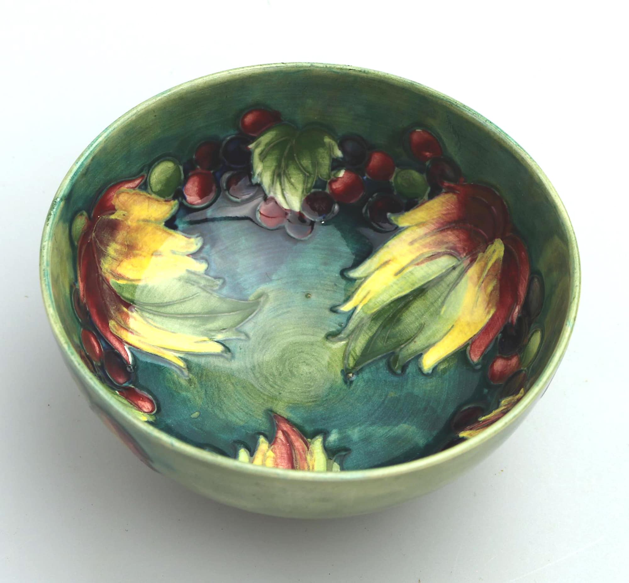 A good William Moorcroft antique British Art Pottery leaf & berry Bowl C.1928