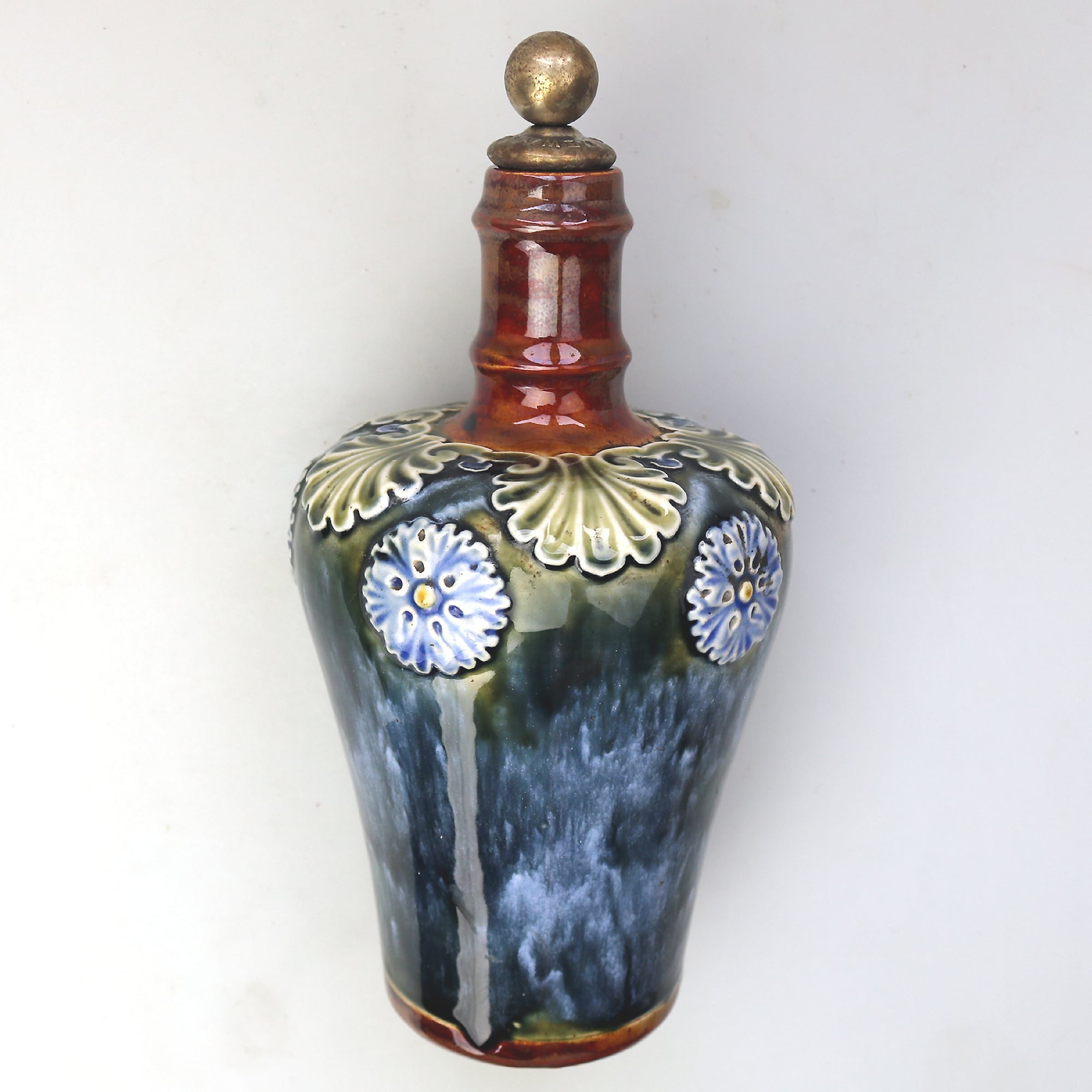 An antique Art Nouveau Royal Doulton pottery Dewars Whiskey Flask C.19thC