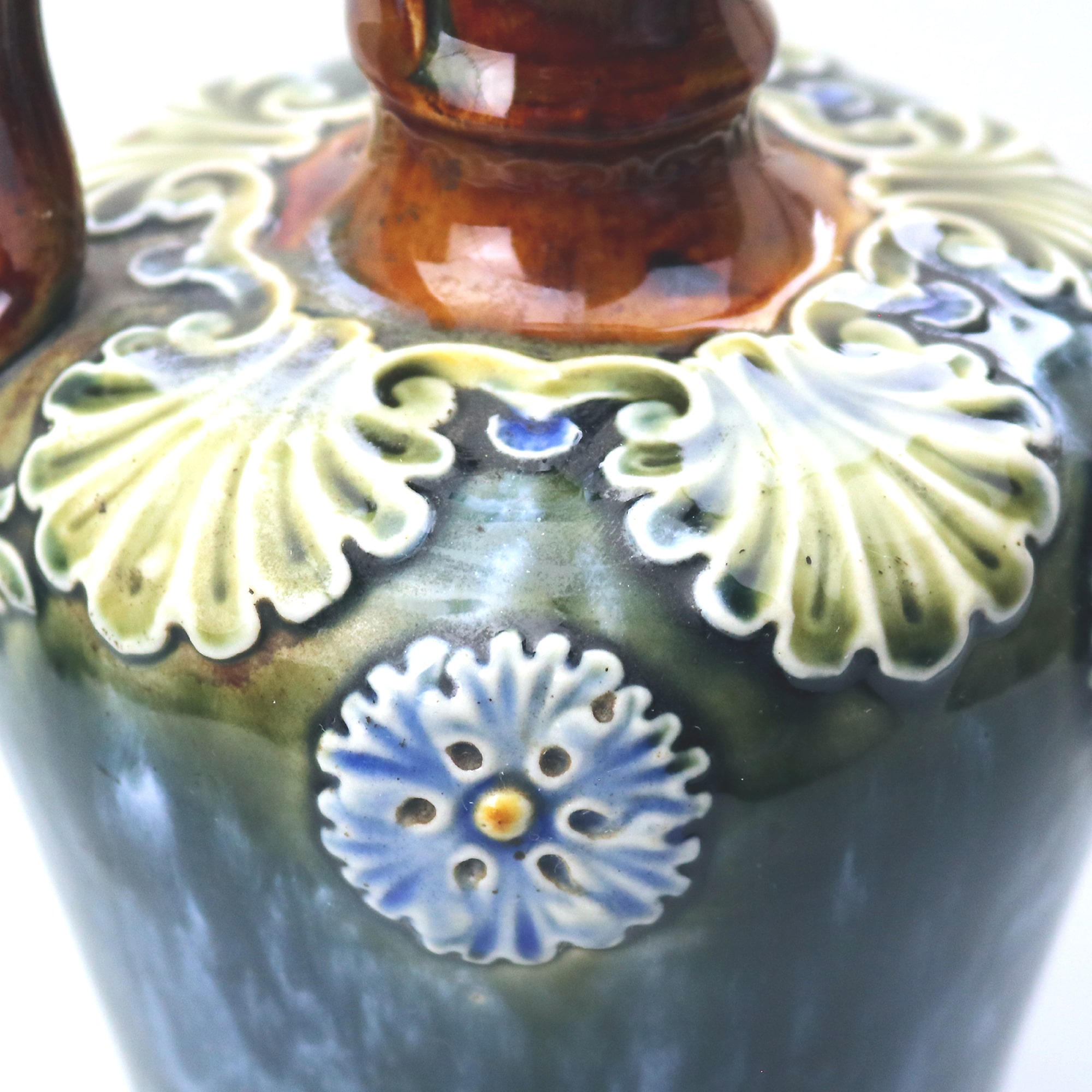 An antique Art Nouveau Royal Doulton pottery Dewars Whiskey Flask C.19thC