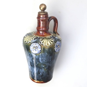An antique Art Nouveau Royal Doulton pottery Dewars Whiskey Flask C.19thC