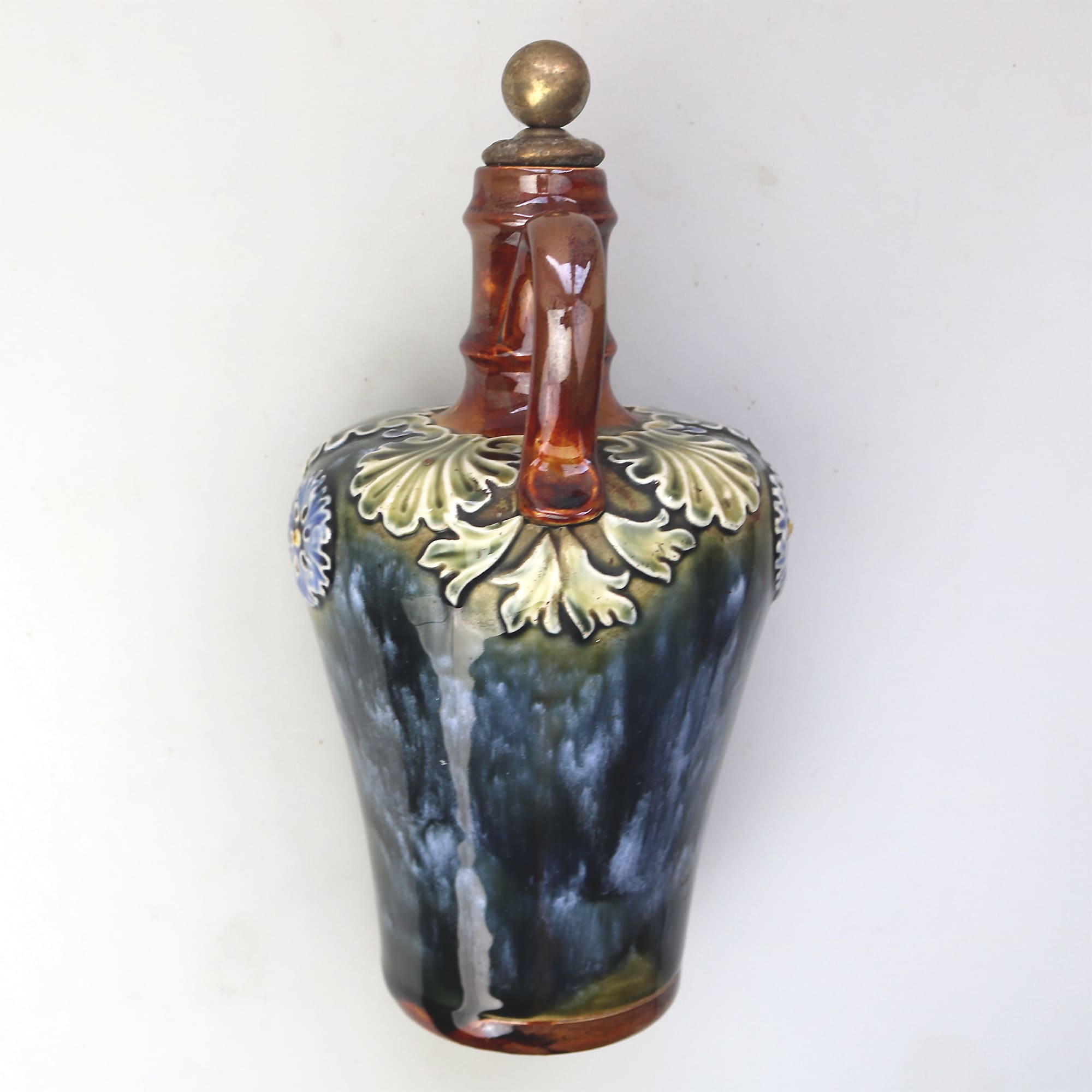 An antique Art Nouveau Royal Doulton pottery Dewars Whiskey Flask C.19thC