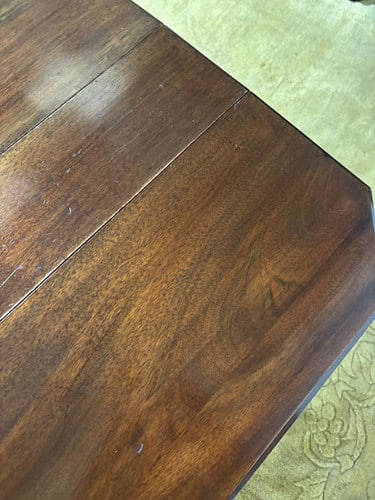 Edwardian mahogany table of small proportions resting on turned legs
