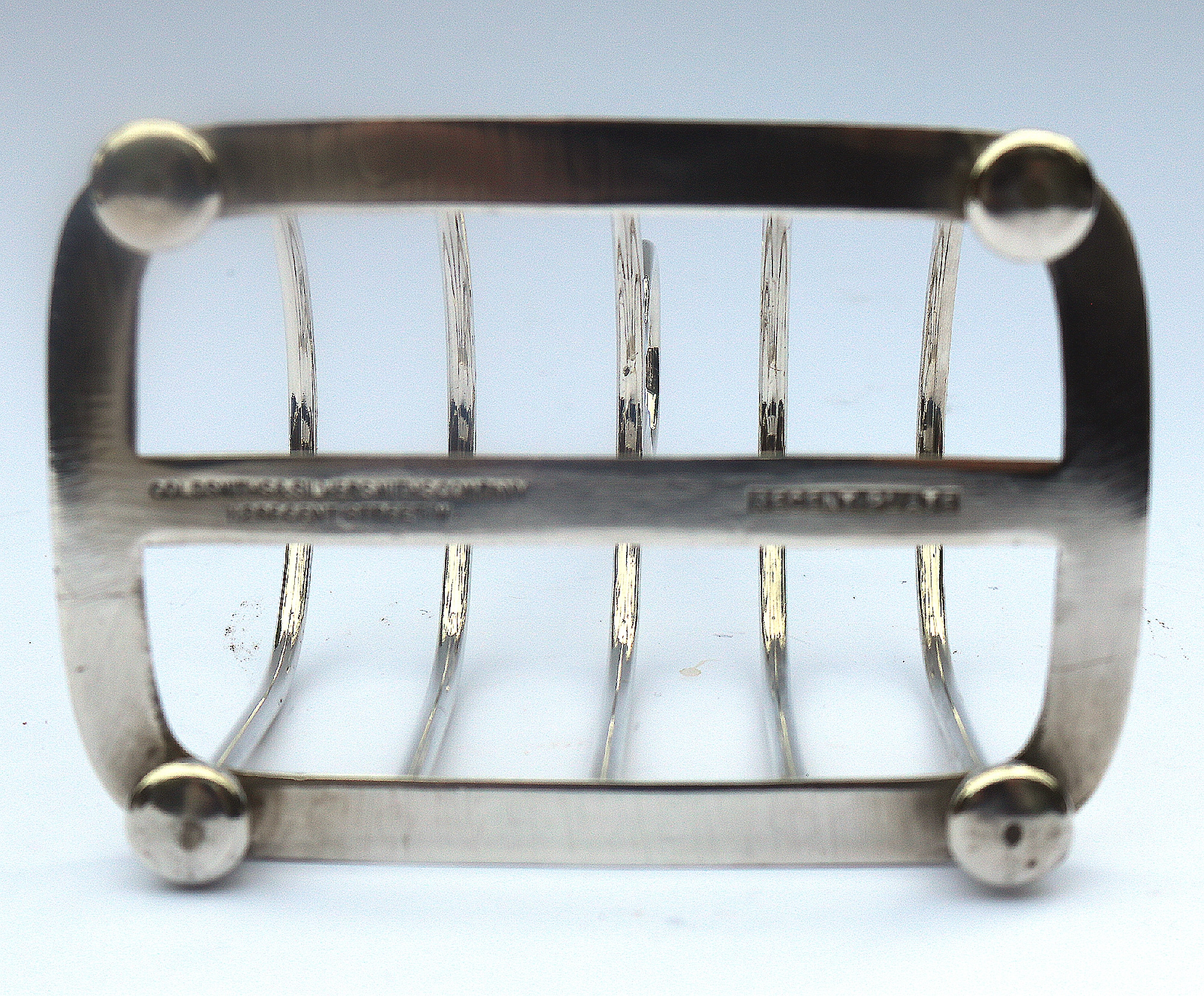 An antique silver plated Toast Rack by Goldsmiths & Silversmiths C.1900