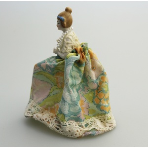 A good antique novelty porcelain half doll with dress - wire frame C.early 20thC