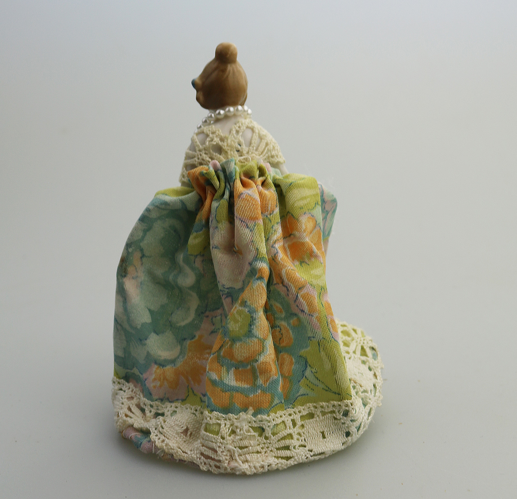 A good antique novelty porcelain half doll with dress - wire frame C.early 20thC