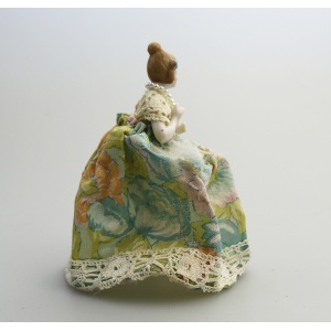 A good antique novelty porcelain half doll with dress - wire frame C.early 20thC
