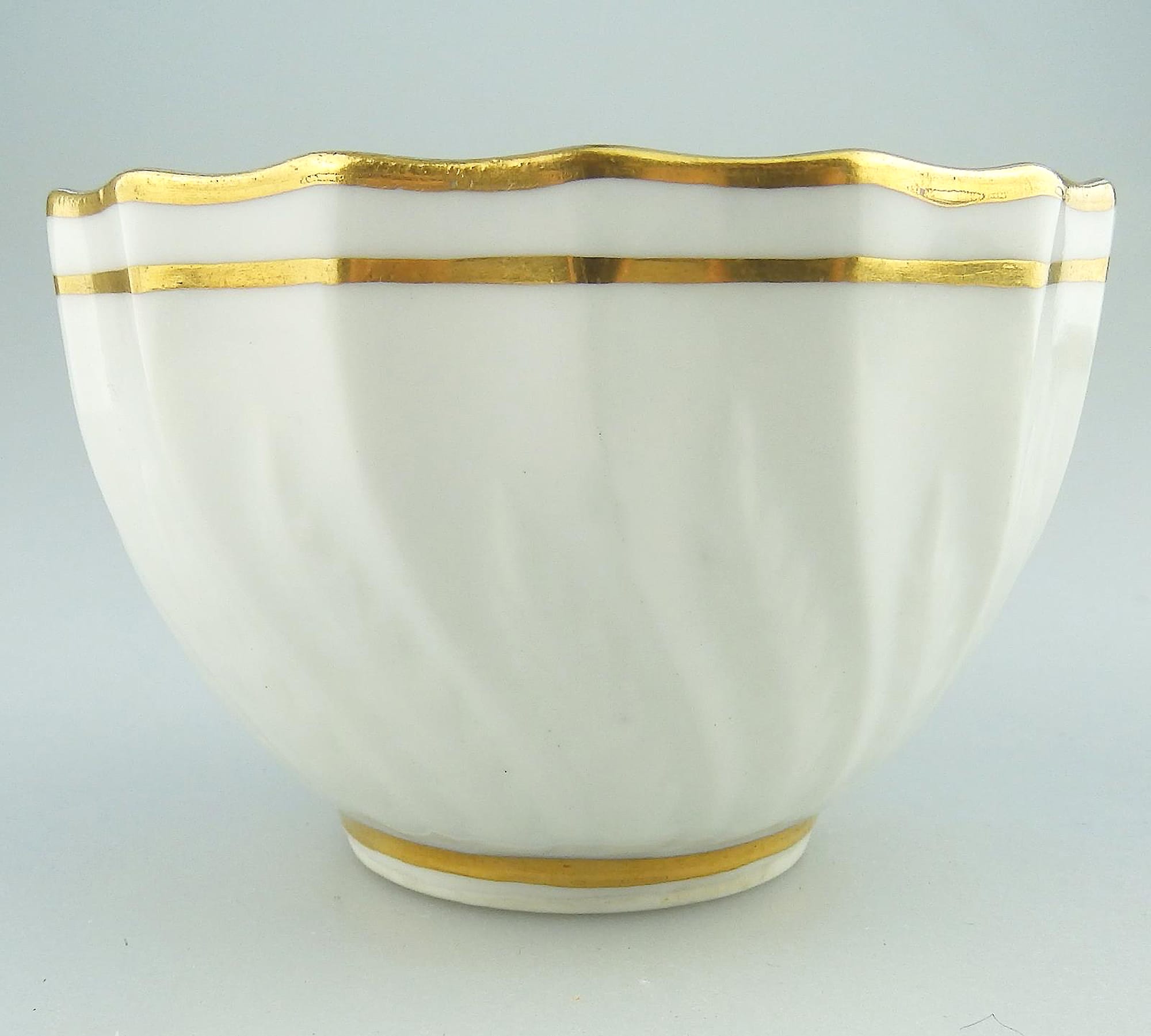 An antique Georgian Royal Crown Derby moulded porcelain gilt Tea Bowl C.1784+