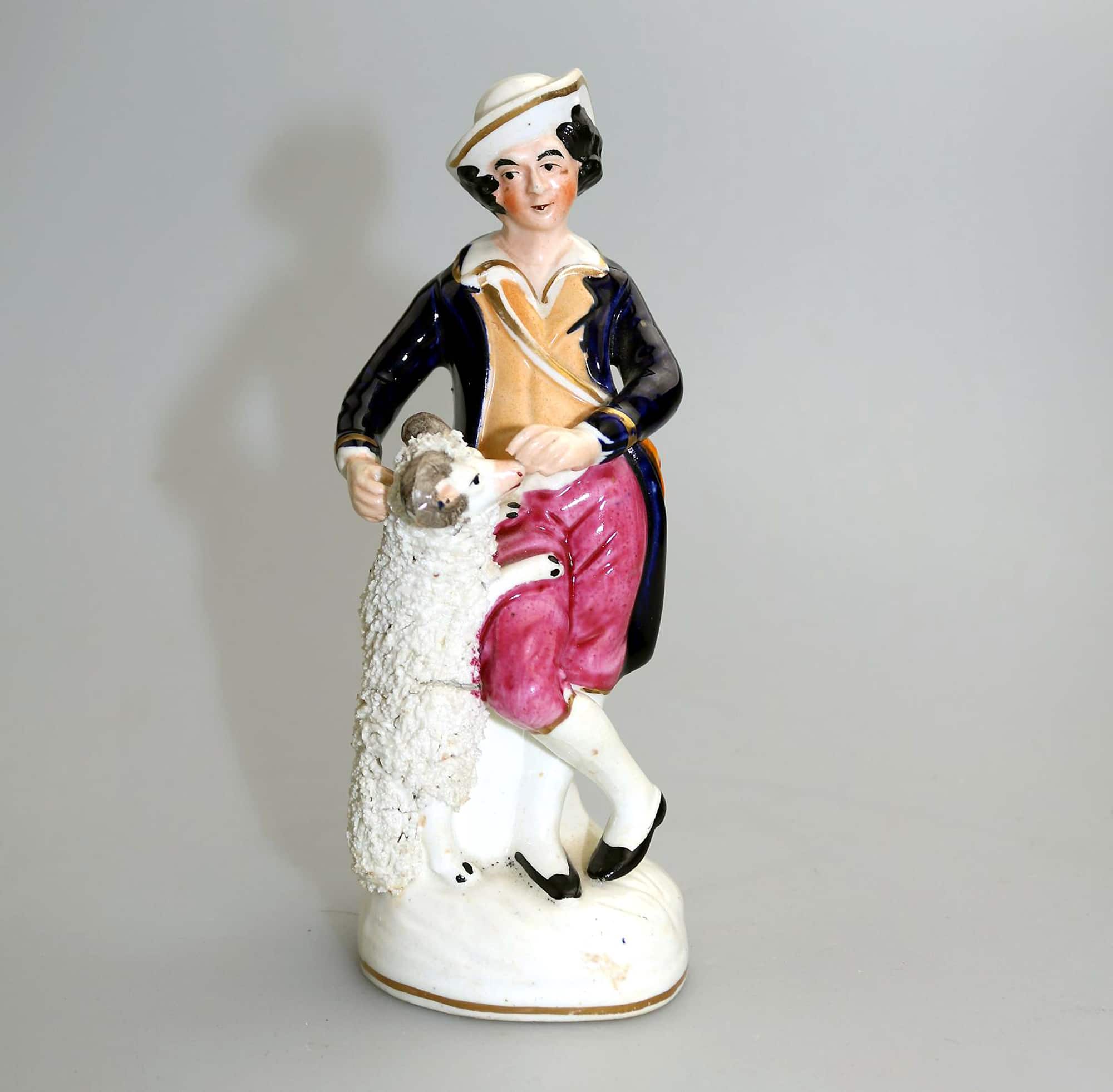 An antique Staffordshire pottery hand-painted Shepherd Figurine C.Mid 19thC