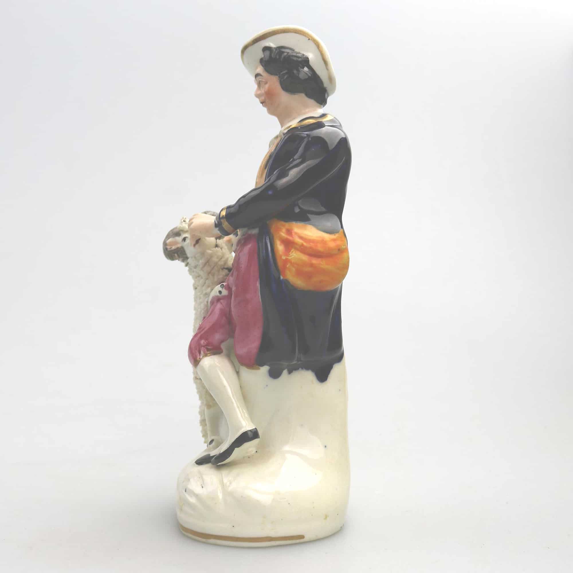 An antique Staffordshire pottery hand-painted Shepherd Figurine C.Mid 19thC