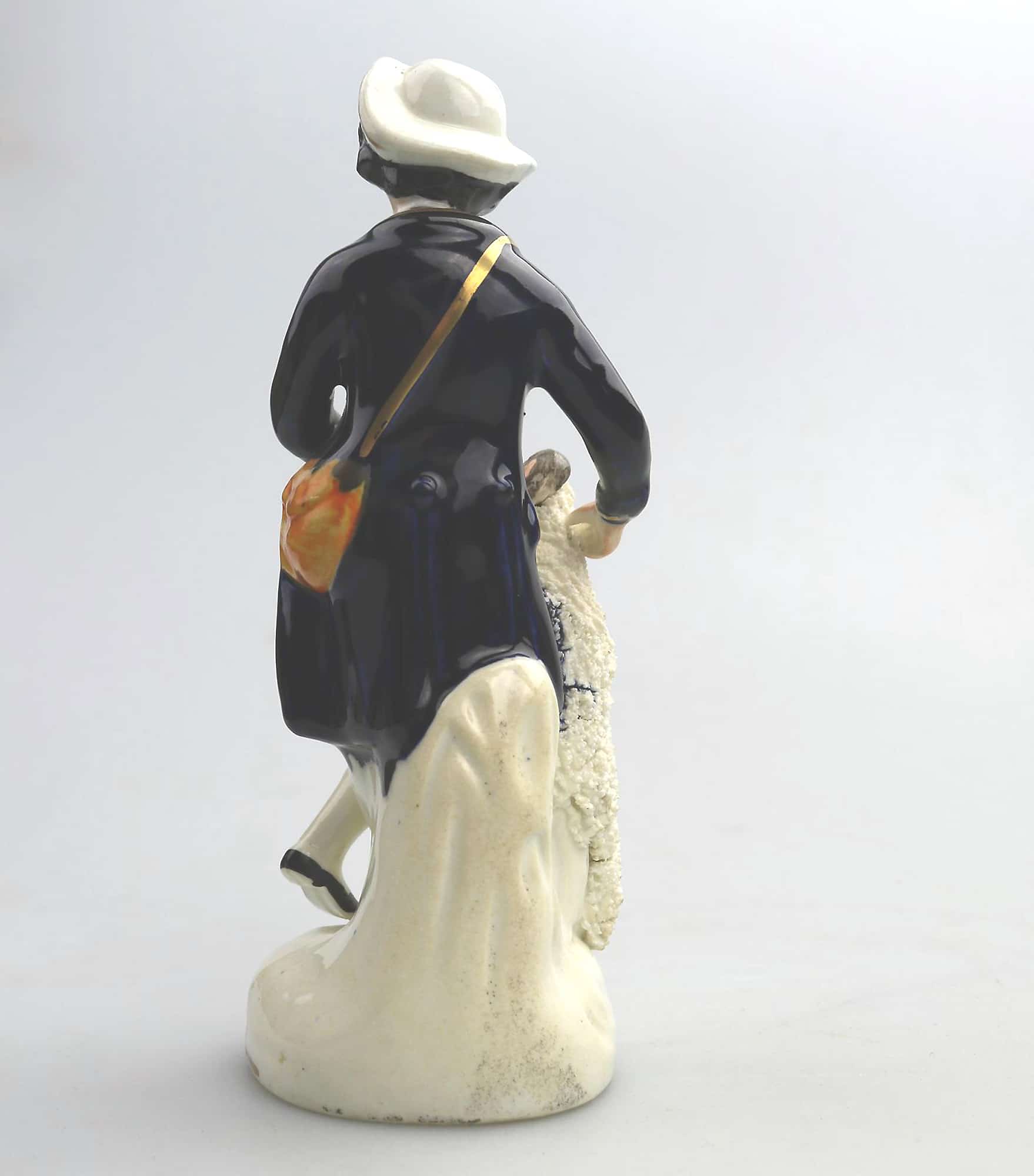 An antique Staffordshire pottery hand-painted Shepherd Figurine C.Mid 19thC