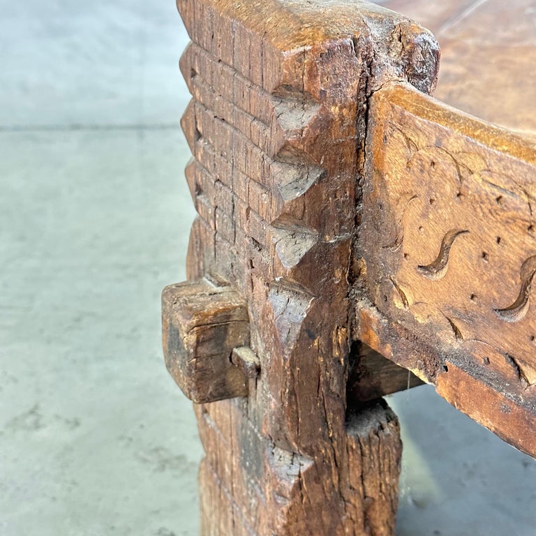 Early 1900s Indian Carved Wooden Chakki Grinder Coffee Table with Iron Detailing