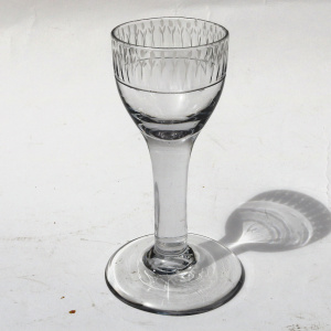 A very unusual antique Georgian stemware glass with engraved tulip border C.18thC