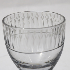 A very unusual antique Georgian stemware glass with engraved tulip border C.18thC