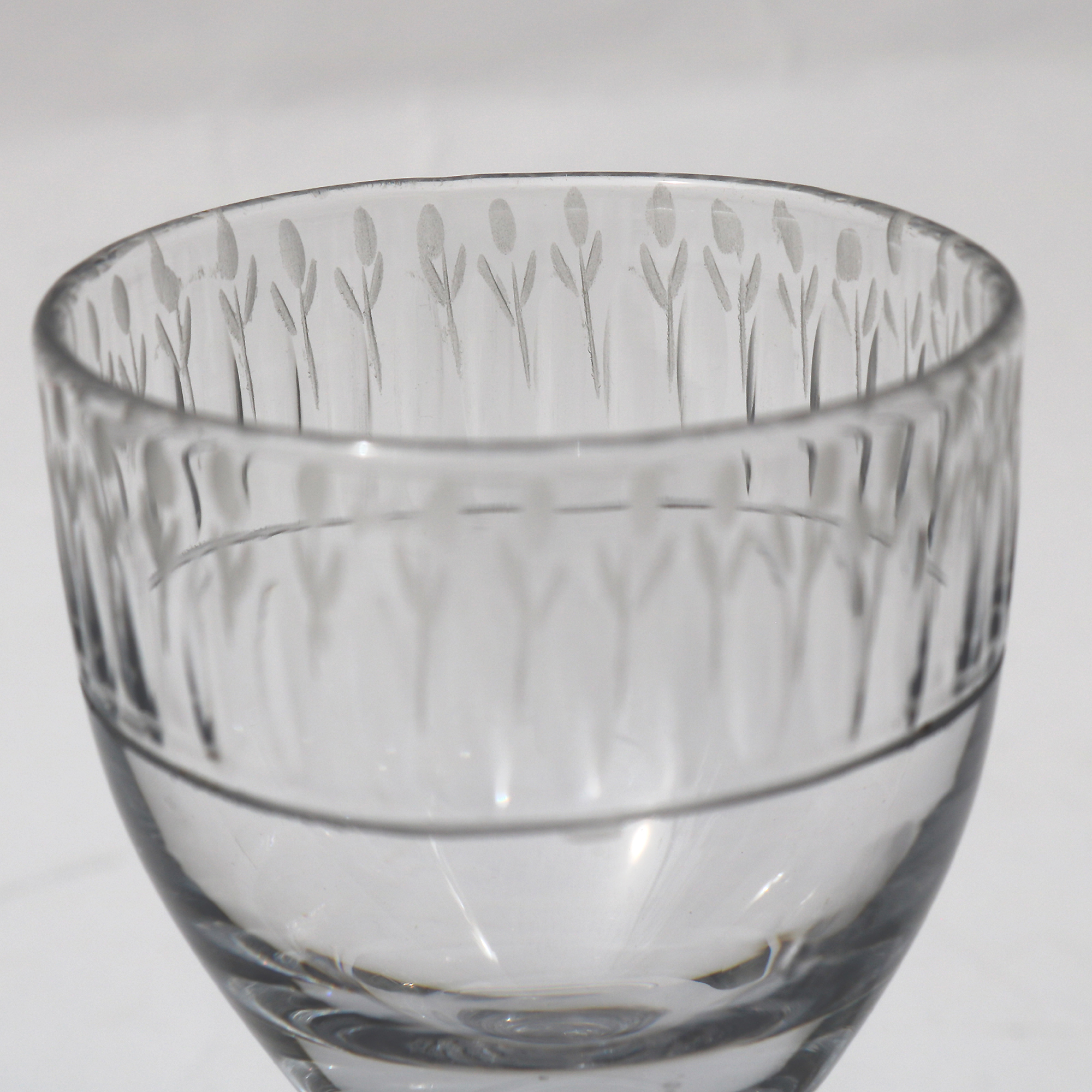 A very unusual antique Georgian stemware glass with engraved tulip border C.18thC