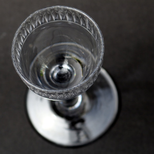 A very unusual antique Georgian stemware glass with engraved tulip border C.18thC