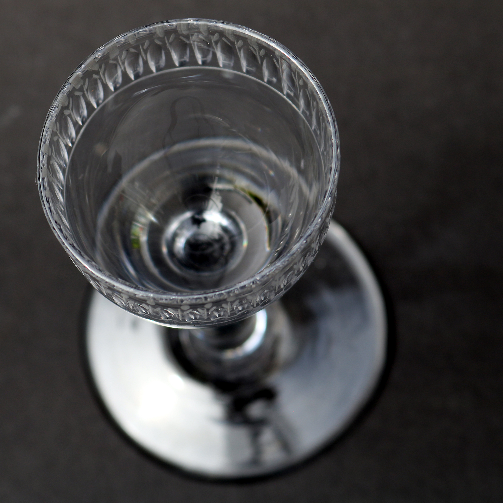 A very unusual antique Georgian stemware glass with engraved tulip border C.18thC