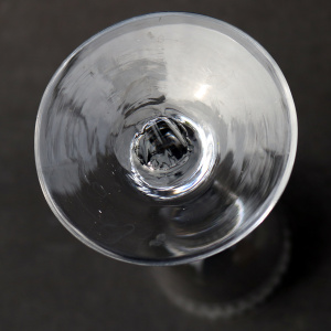 A very unusual antique Georgian stemware glass with engraved tulip border C.18thC