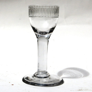 A very unusual antique Georgian stemware glass with engraved tulip border C.18thC