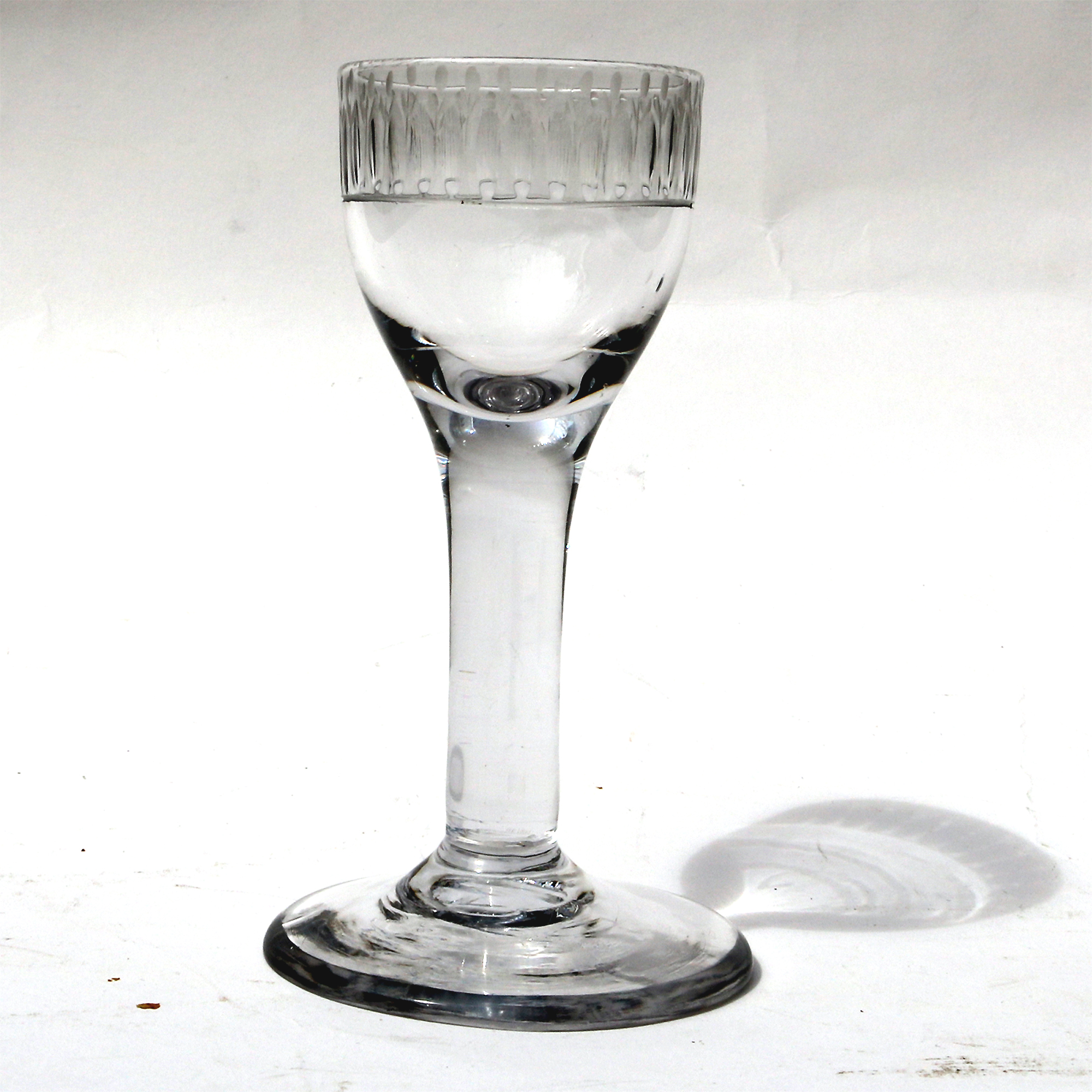 A very unusual antique Georgian stemware glass with engraved tulip border C.18thC