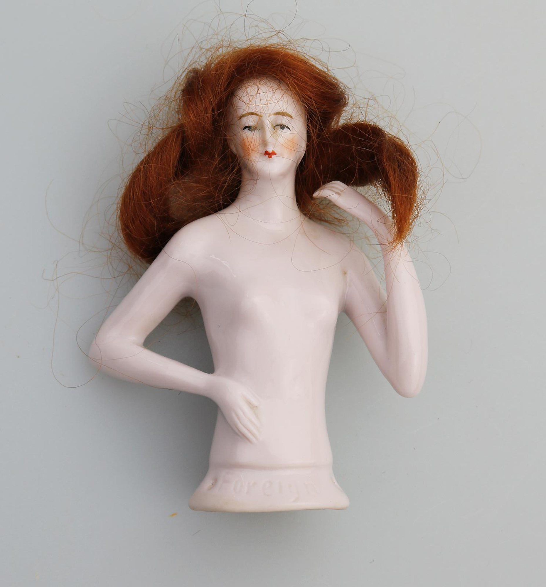 A superb Art Deco German porcelain bathing beauty half doll with hair C.1920's
