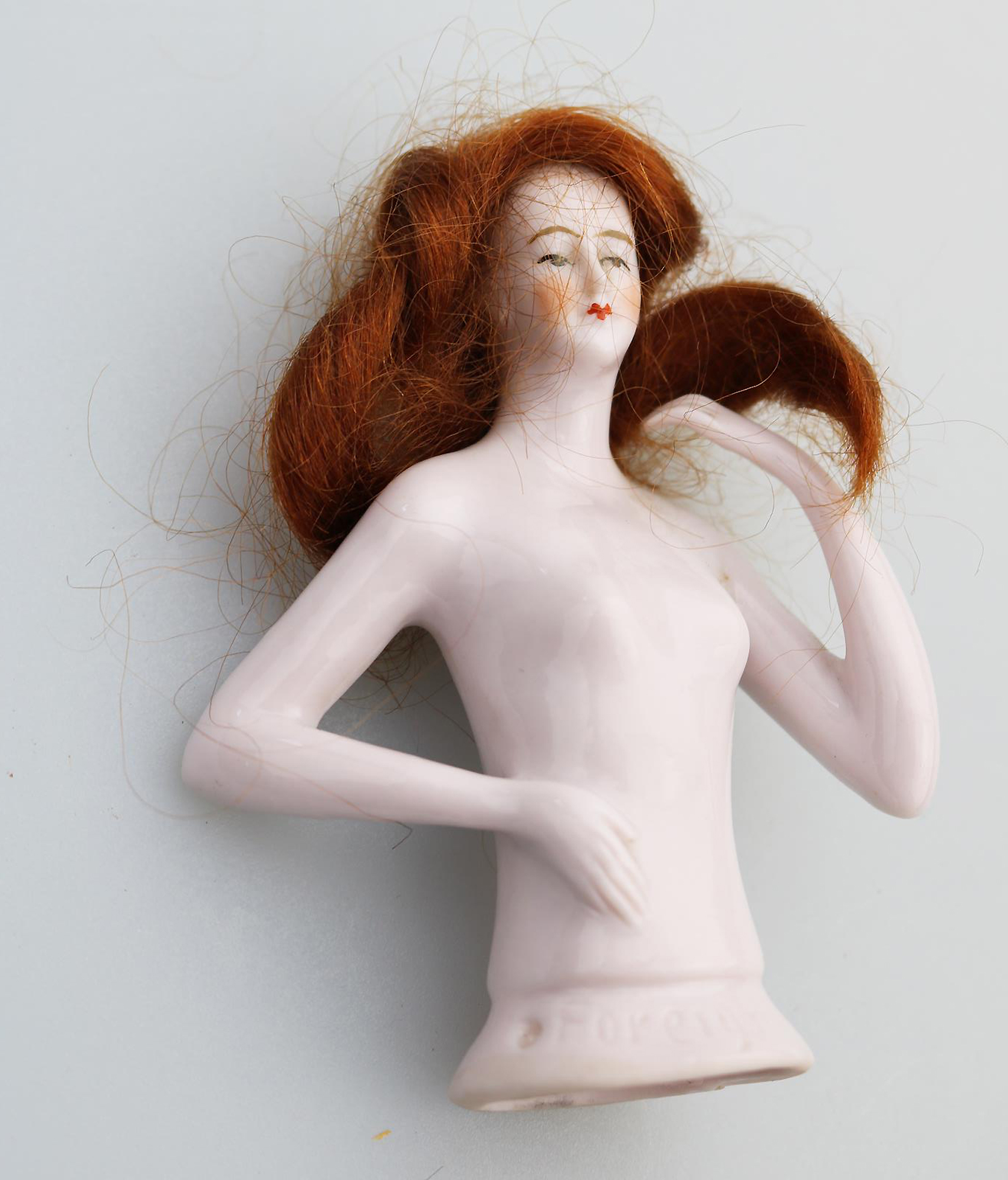 A superb Art Deco German porcelain bathing beauty half doll with hair C.1920's