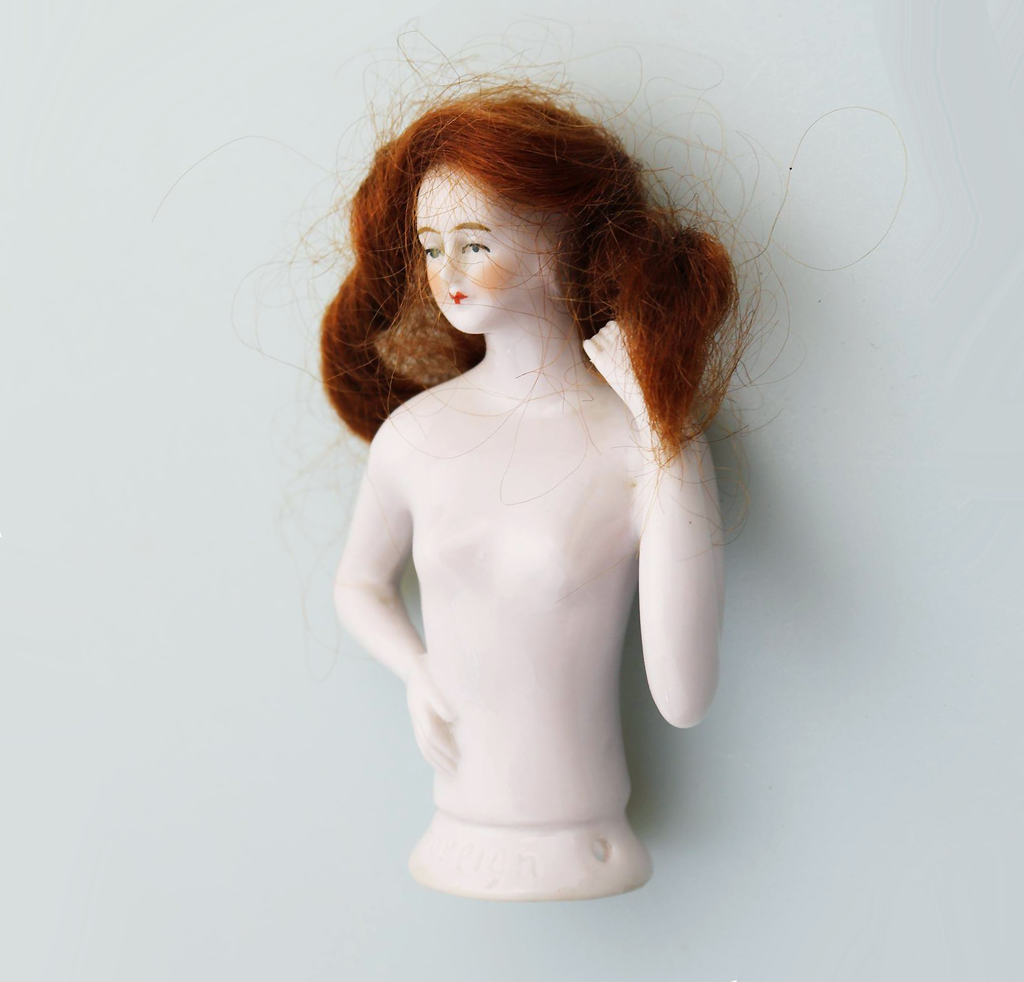A superb Art Deco German porcelain bathing beauty half doll with hair C.1920's