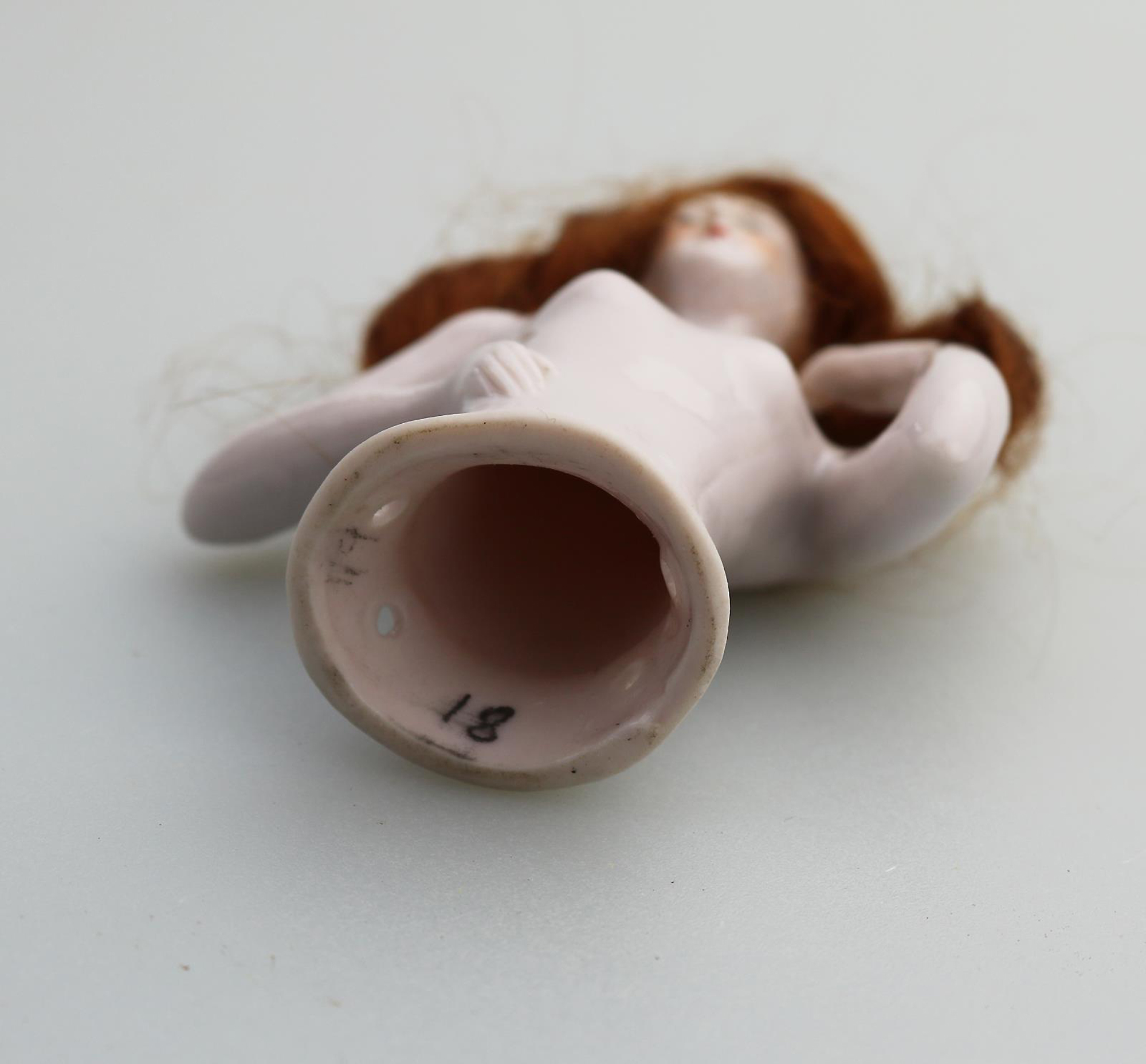A superb Art Deco German porcelain bathing beauty half doll with hair C.1920's