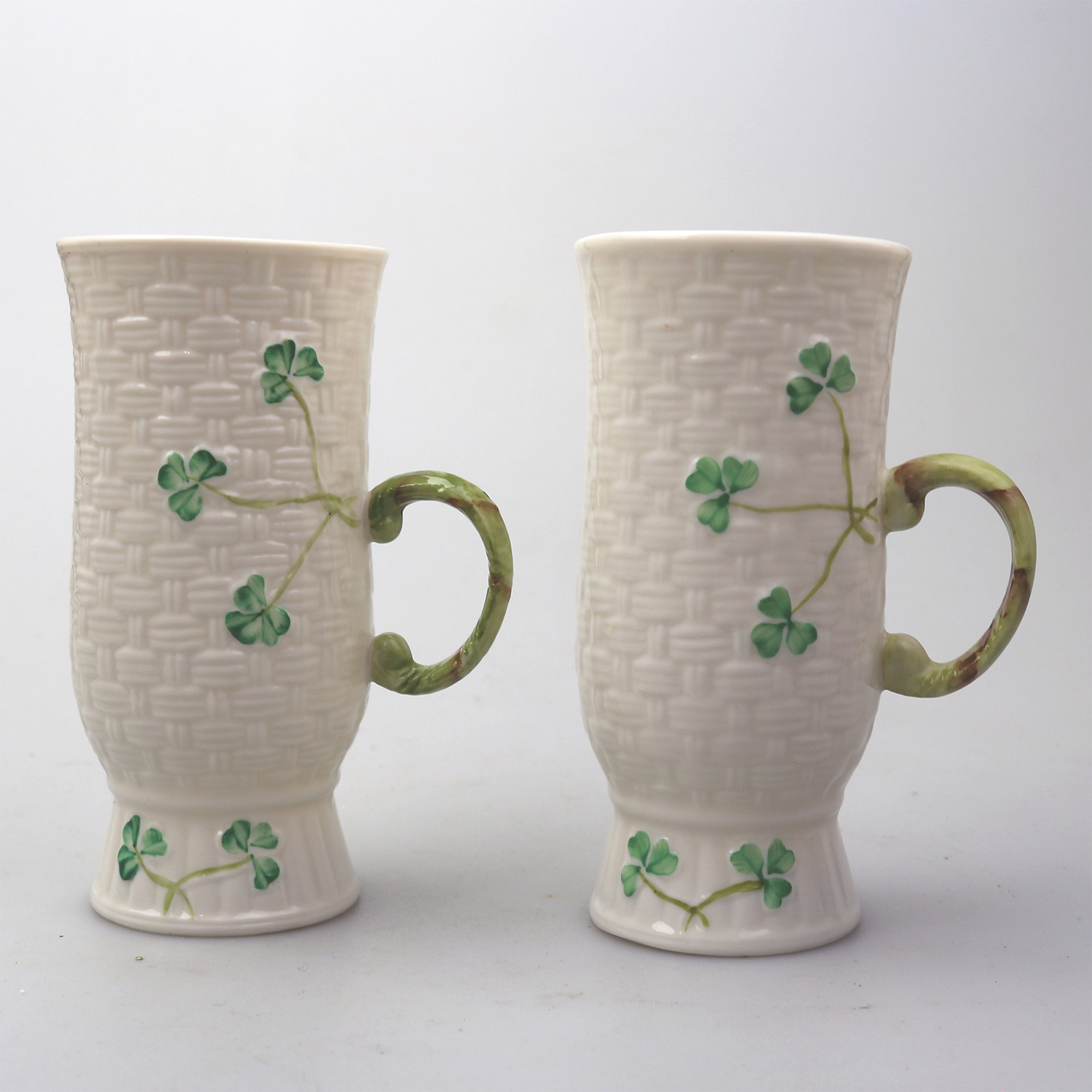 A pair Vintage Irish Belleek porcelain coloured handled Shamrock Beakers C.20th+