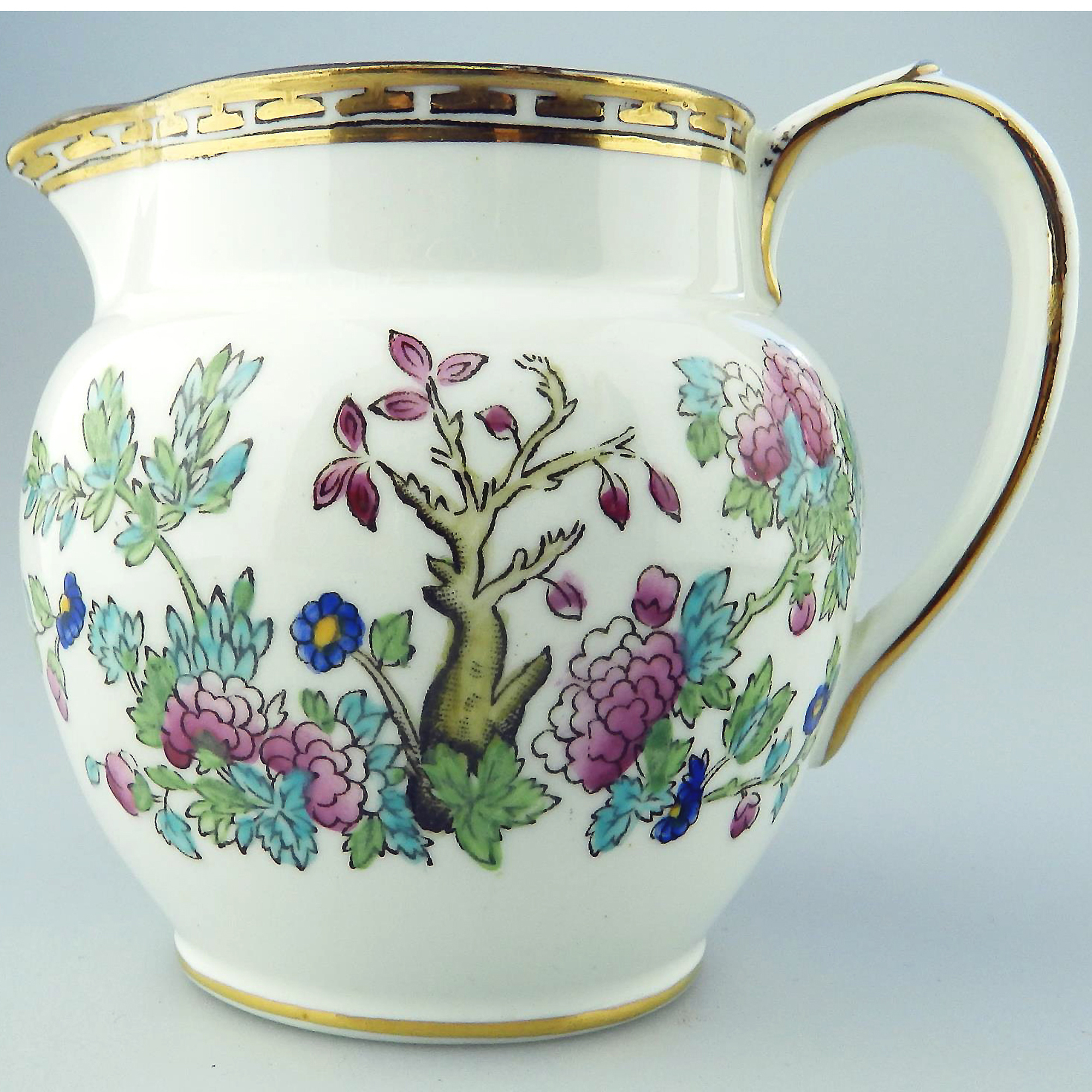 An antique Harrods Victorian pottery hand coloured Indian Tree Jug C.1891+