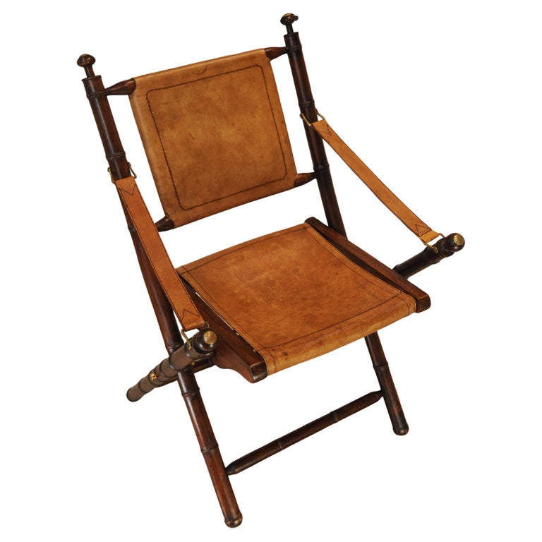 A Folding Safari Chair With Stitched Tan Leather Straps & Seat Faux Bamboo Legs
