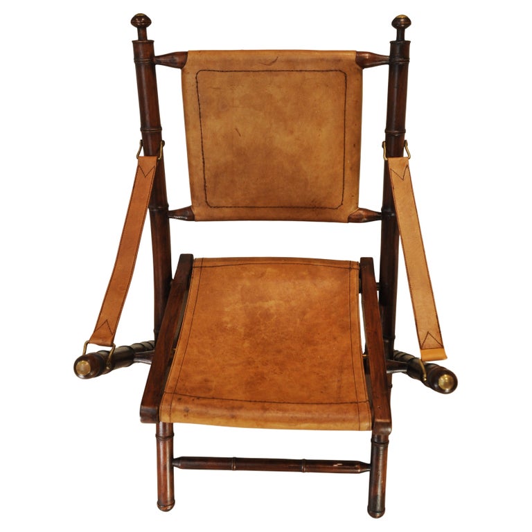 A Folding Safari Chair With Stitched Tan Leather Straps & Seat Faux Bamboo Legs