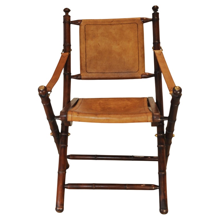 A Folding Safari Chair With Stitched Tan Leather Straps & Seat Faux Bamboo Legs