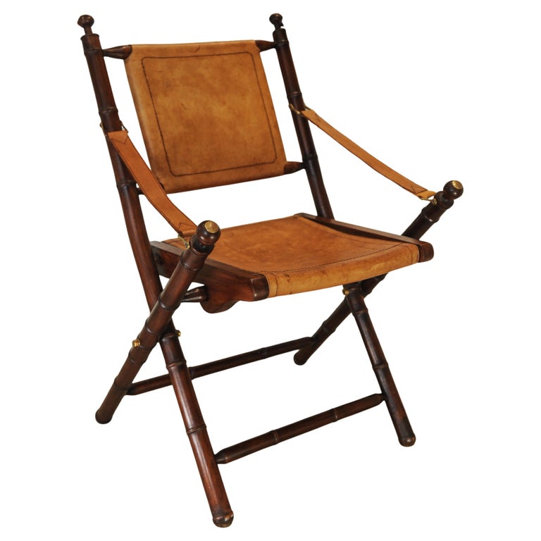 A Folding Safari Chair With Stitched Tan Leather Straps & Seat Faux Bamboo Legs