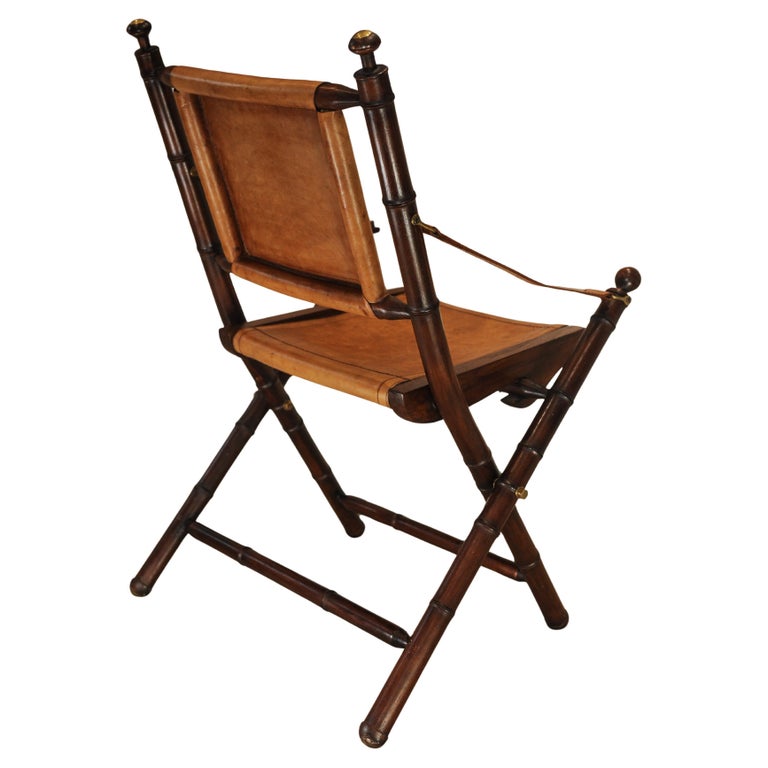 A Folding Safari Chair With Stitched Tan Leather Straps & Seat Faux Bamboo Legs