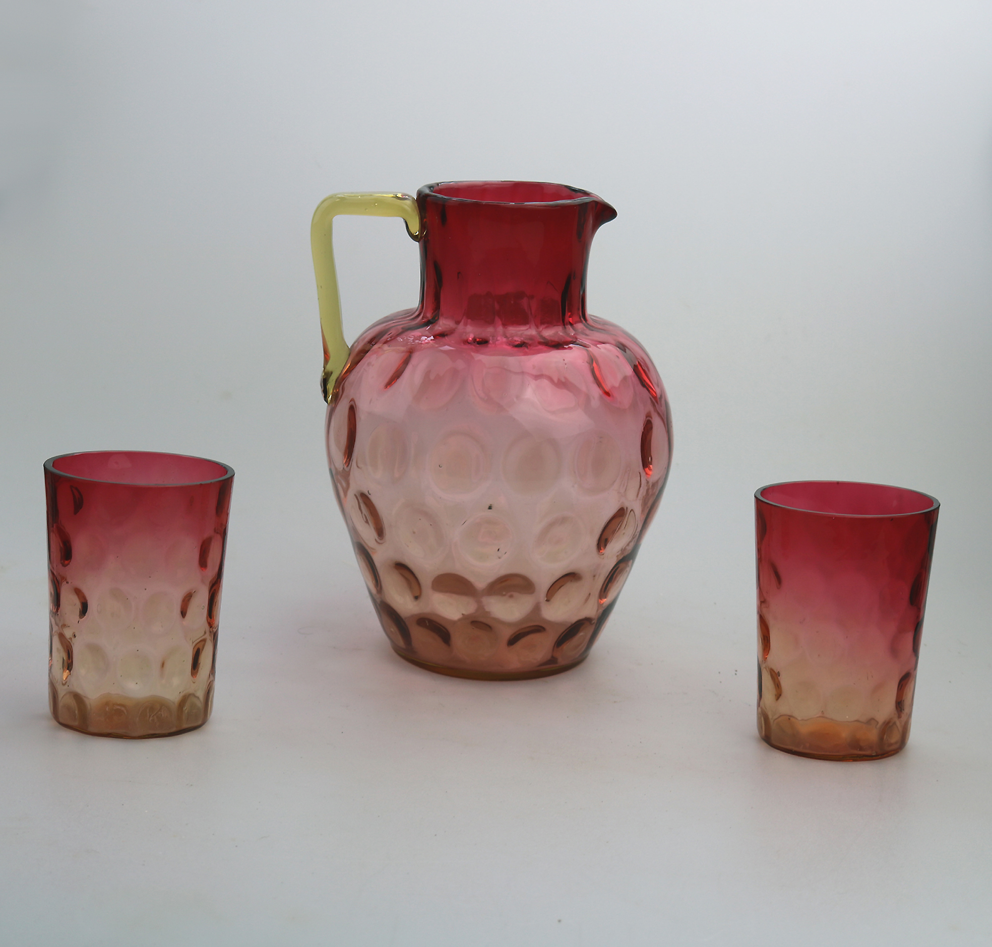 A good antique Victorian glass dimpled amberina cranberry Lemonade Set C.19thC