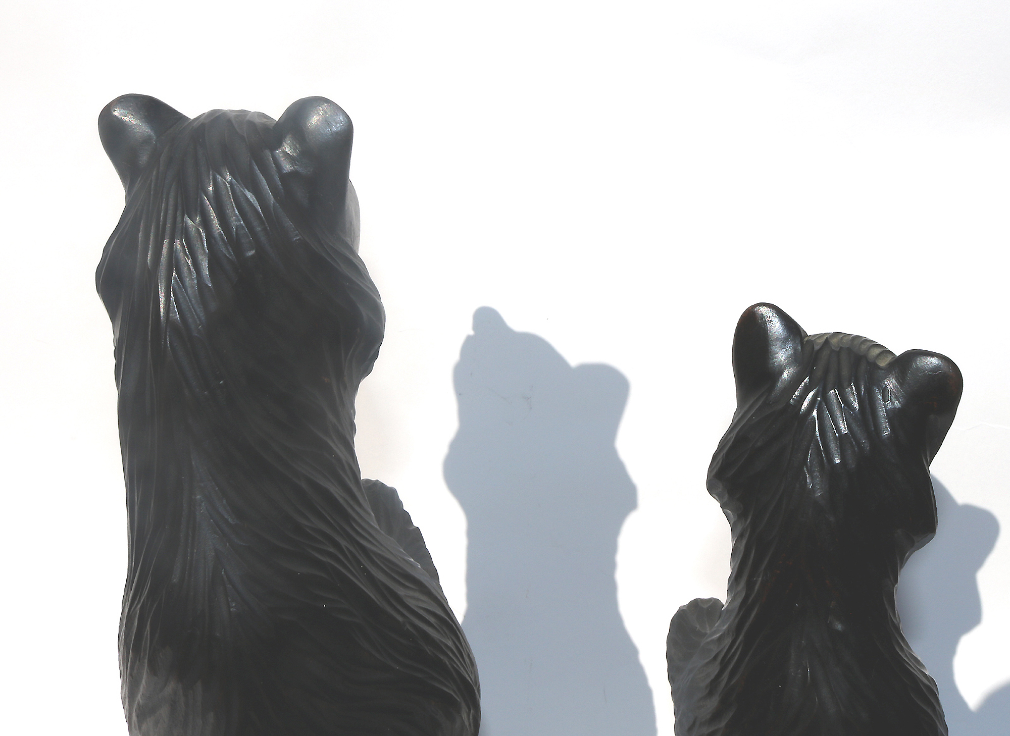 A large pair of good antique Treen Black Forest Begging Bears with glass eyes C.19thC