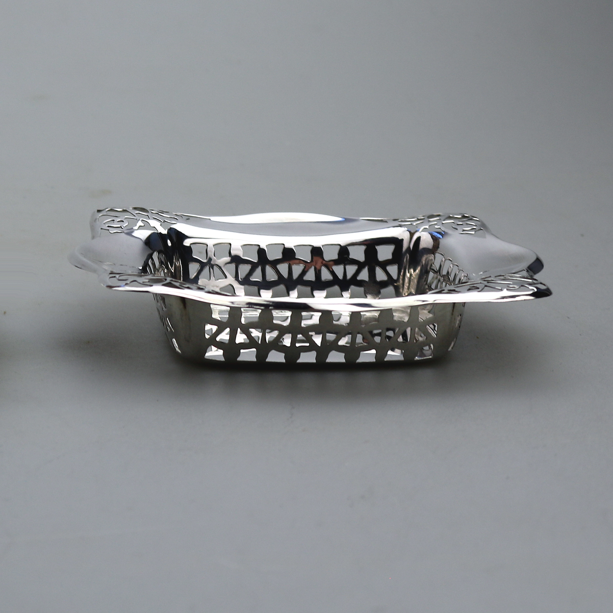 A good antique English Chester solid silver pierced square Bonbon Dish C.1927