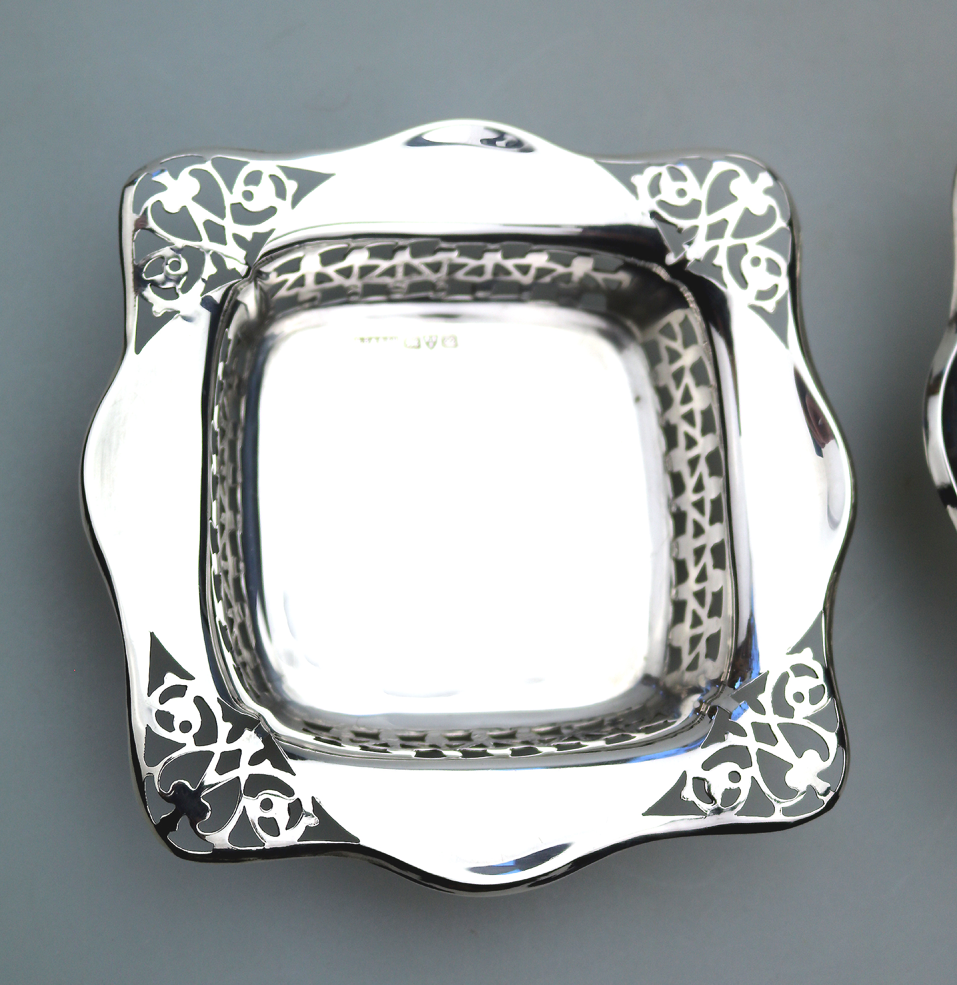 A good antique English Chester solid silver pierced square Bonbon Dish C.1927
