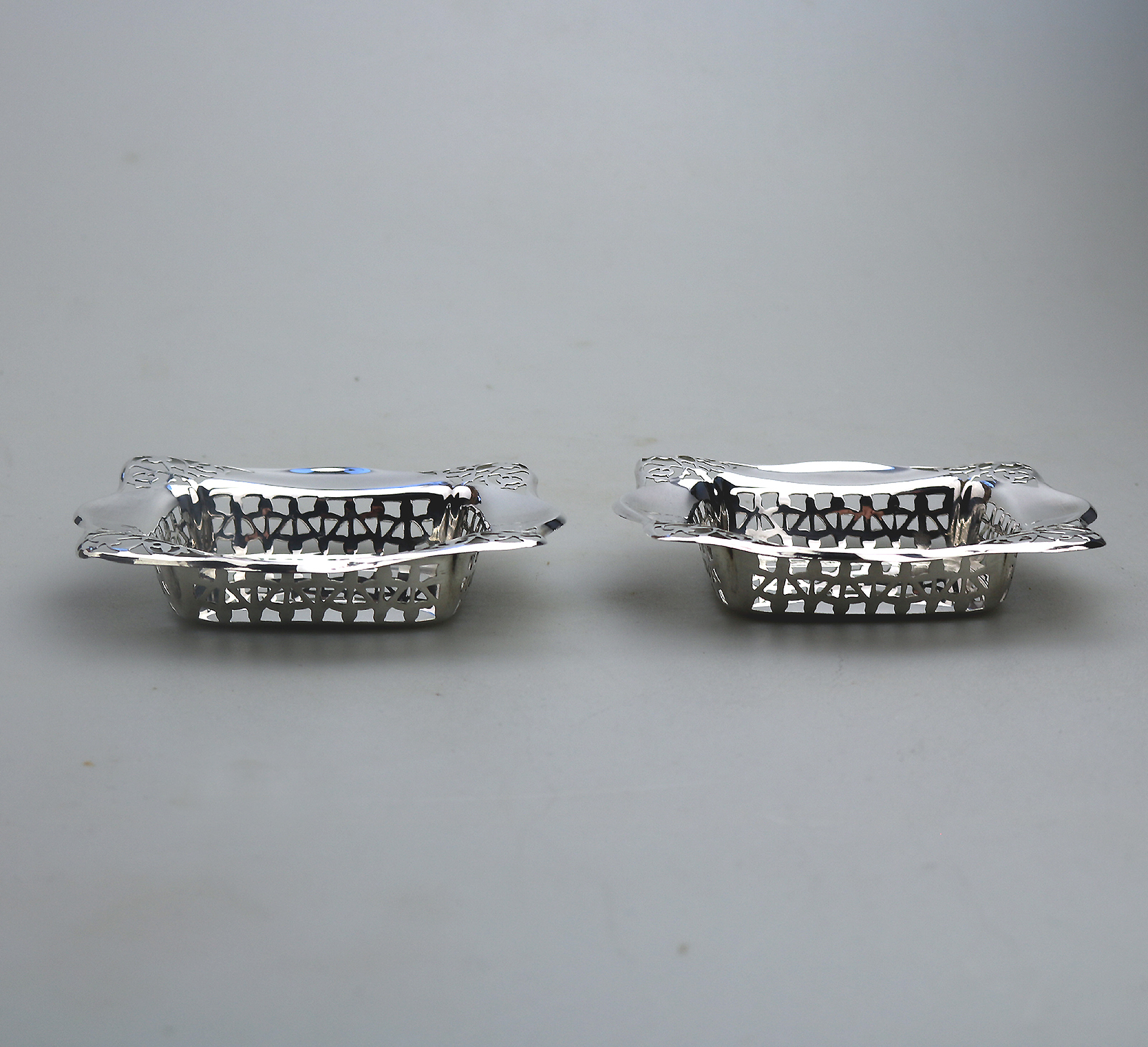 A good antique English Chester solid silver pierced square Bonbon Dish C.1927