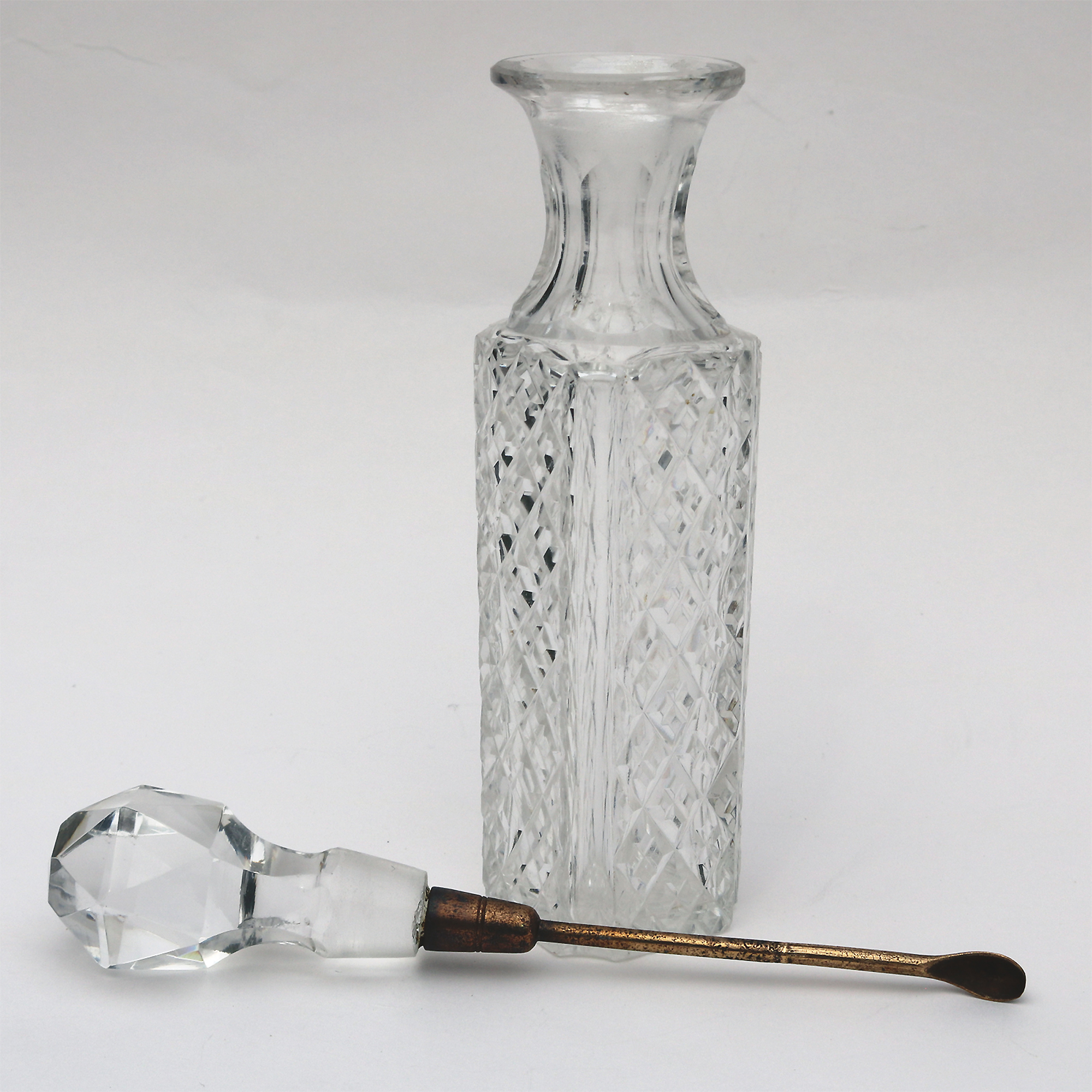 An antique cut glass Cayenne Pepper Cruet Bottle & gilt Spoon C.19thC