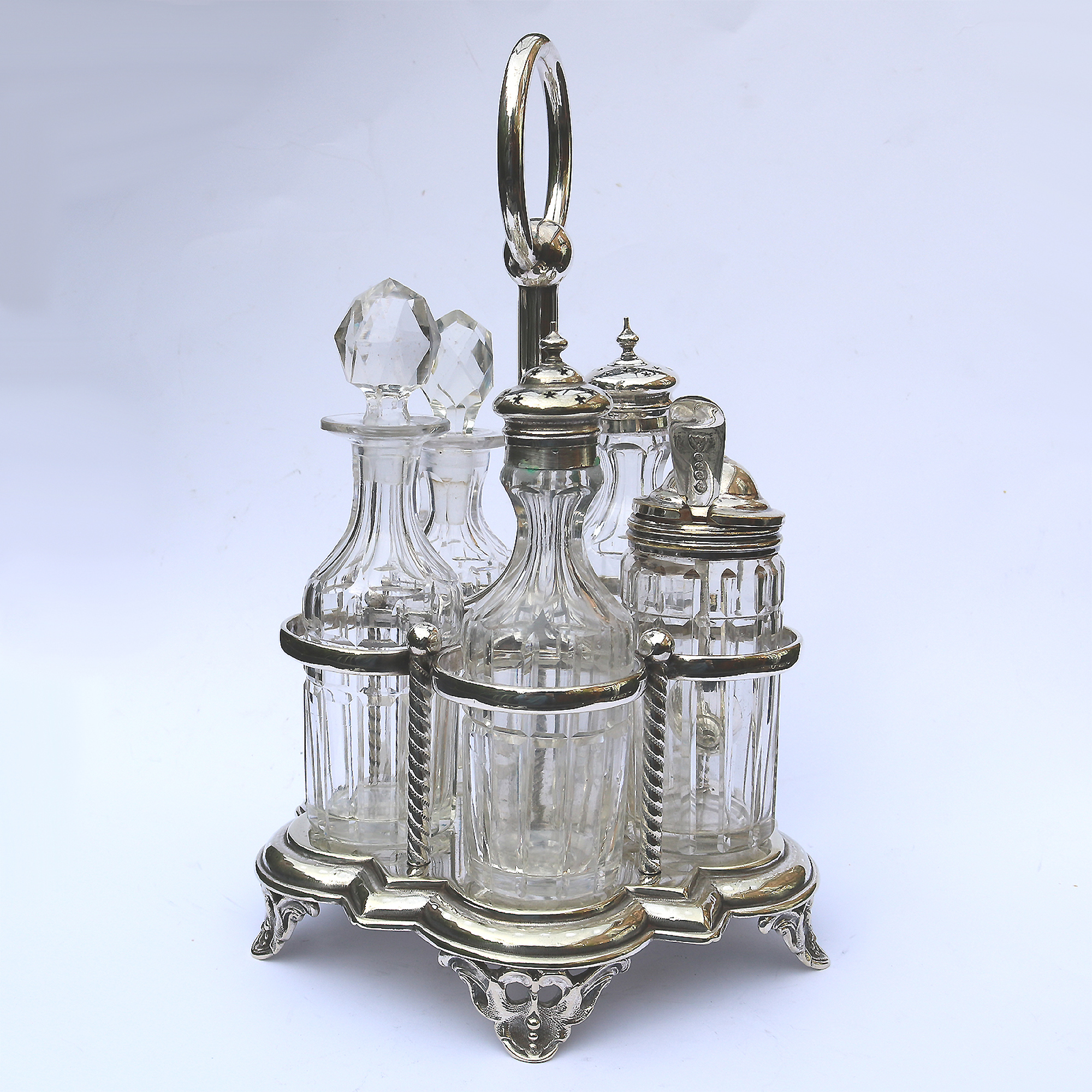 A good antique English silver plate & cut glass 5-bottle table cruet stand C.19thC