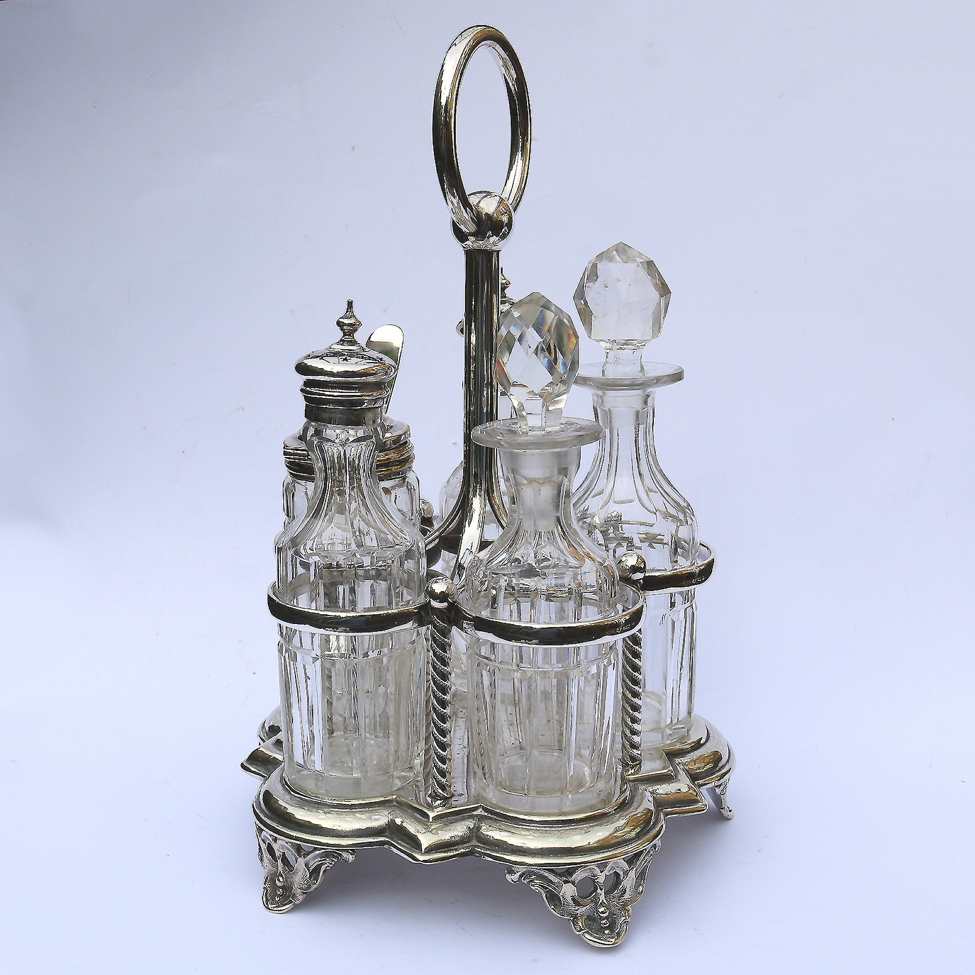 A good antique English silver plate & cut glass 5-bottle table cruet stand C.19thC