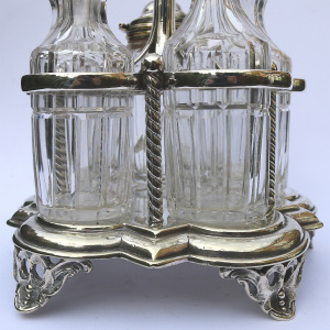 A good antique English silver plate & cut glass 5-bottle table cruet stand C.19thC
