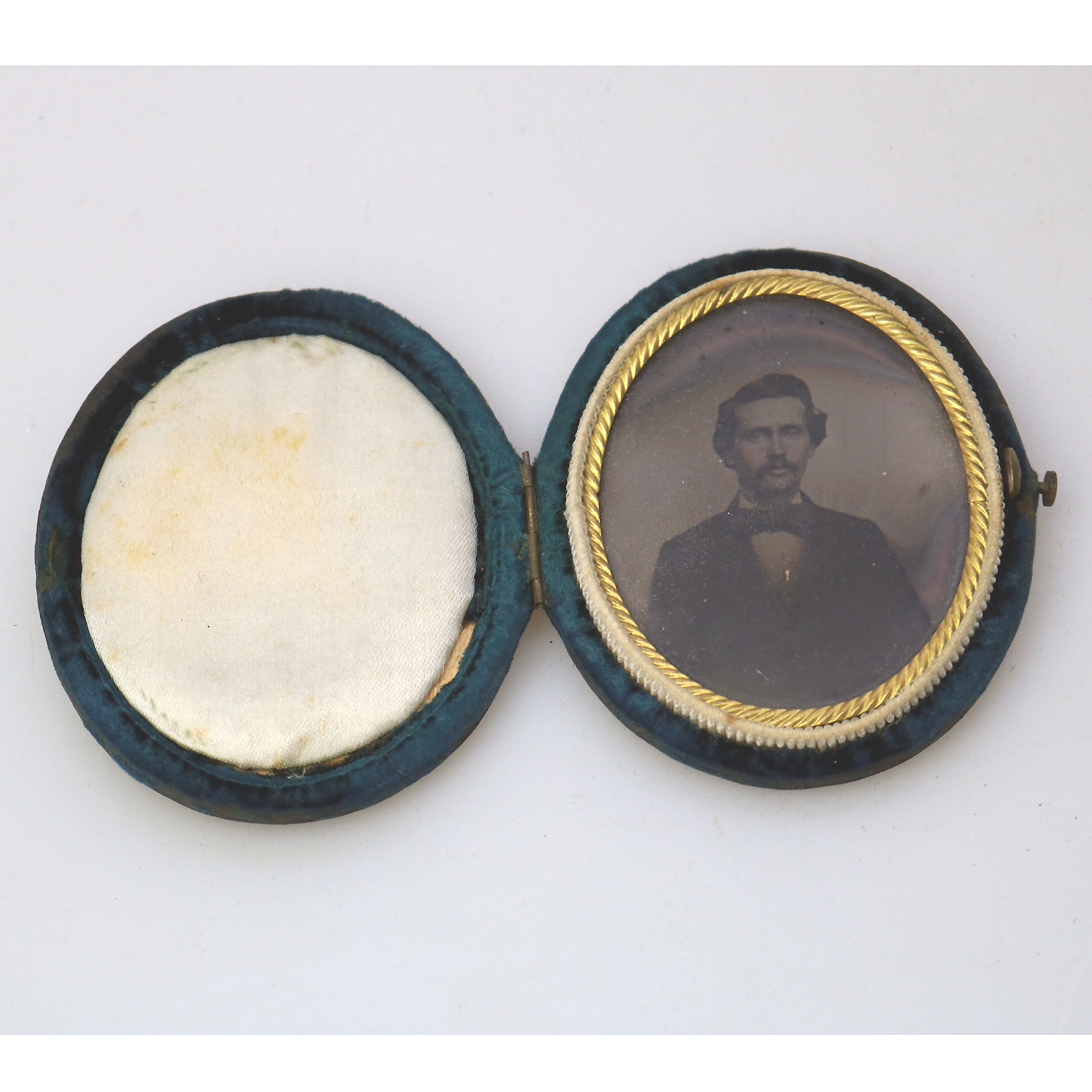 A small & oval antique Victorian daguerreotype in original velvet case C.1850's