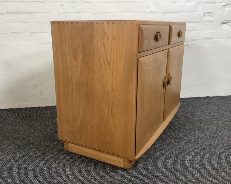 Ercol Windsor Cabinet In Light Finish.