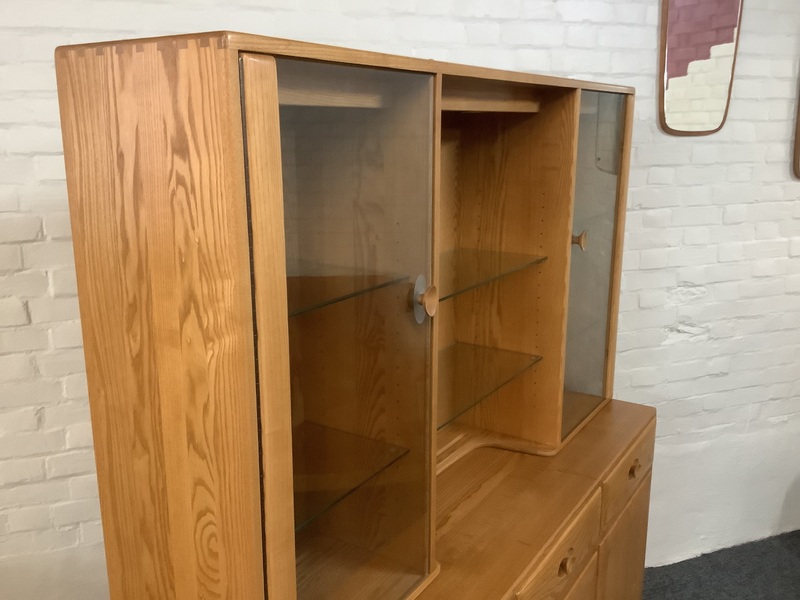 Ercol Windsor High Display Cabinet In Light Finish.